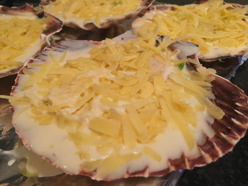 Adding the cheese to the scallop shells in my St. David's Day recipe, Coquilles St. David's