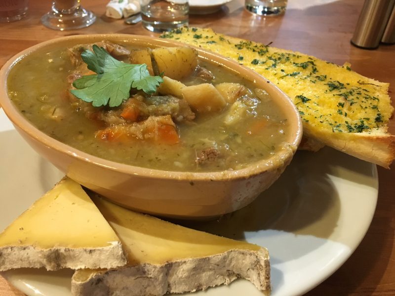 Welsh lamb cawl served with cheese and bread; one of the most comforting British foods