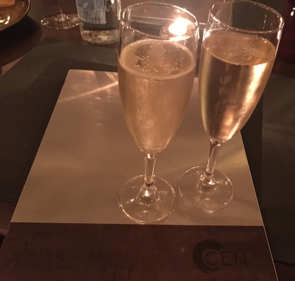 Two filled champagne glasses