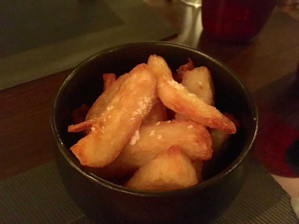 Small bowl of golden brown chunky chips