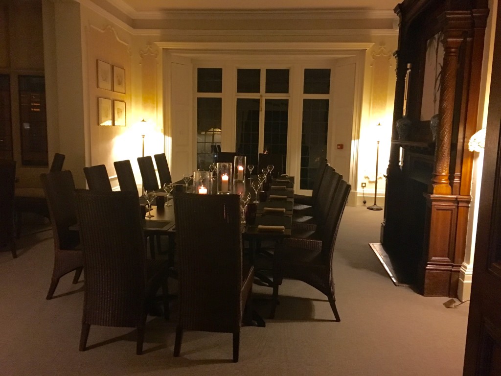 A 19th century dining room with long table and chairs