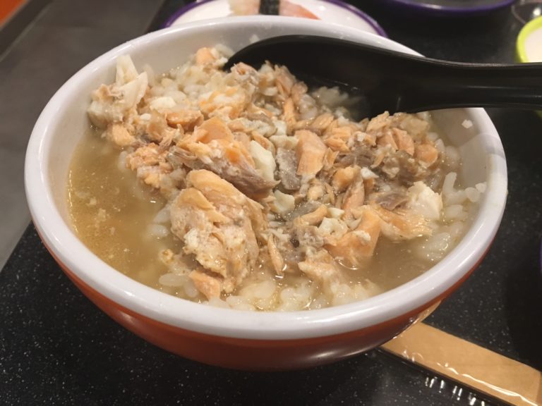 Salmon, seabass and rice in broth