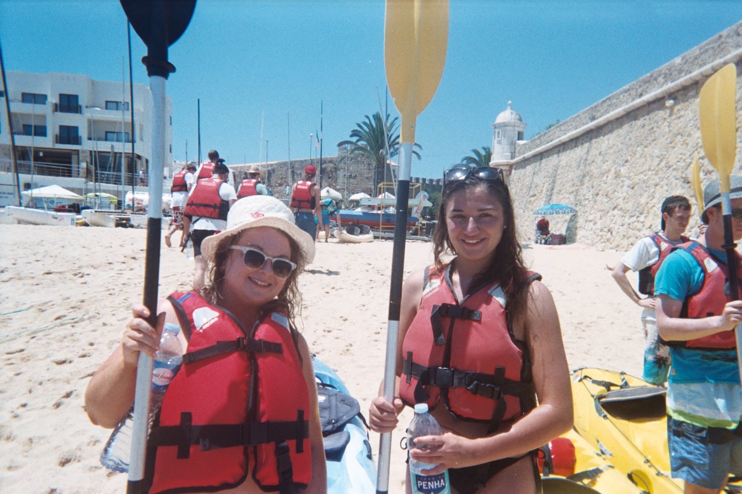 Holding our paddles, about to go kayaking in Lagos in the Algarve, Portugal