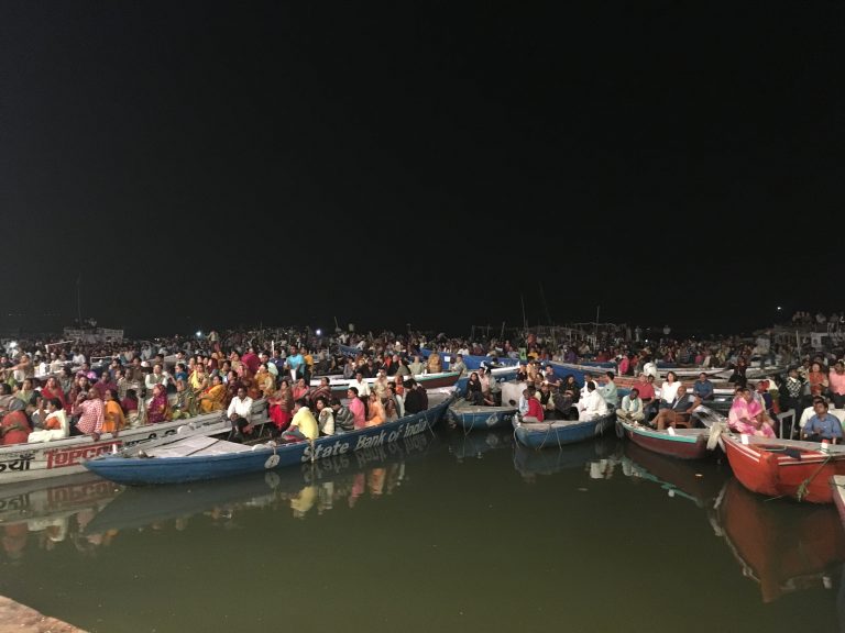Tourists on boats watching Ganga Aarti in Varanasi