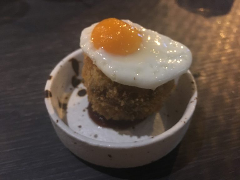 Corned beef hash, fried quail egg
