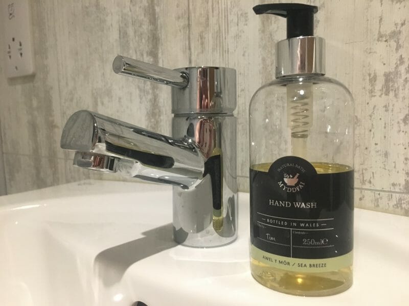 Handwash standing next to a tap in the bathroom at Bluestone Wales