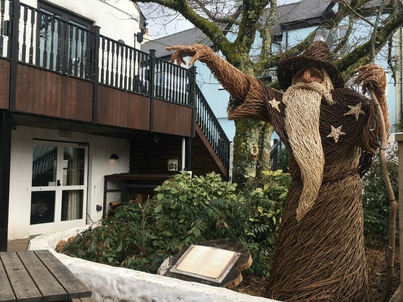 A giant wizard made out of wicker/straw, pointing in the direction of the Knight's Tafarn pub