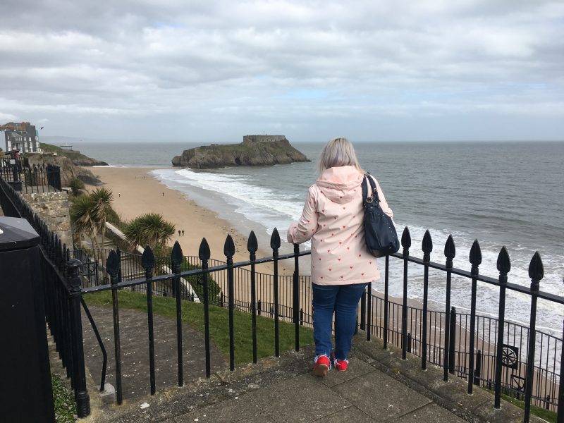 A girl pictured looking across to St. Catherine's Fort, Tenby