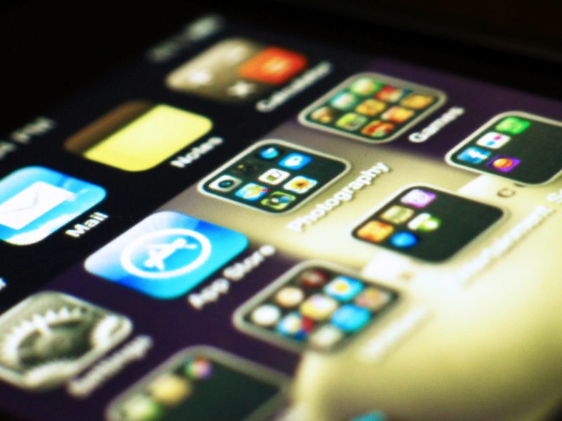 Apps on an iPhone screen - playing games is a great way to stay entertained on a long-haul flight