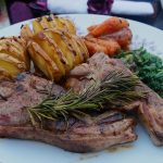 ak-smoked lamb chops with garlic and rosemary, teamed with kale, roast carrots and Hasselback potatoes - the main course in the Welsh three-course dinner menu