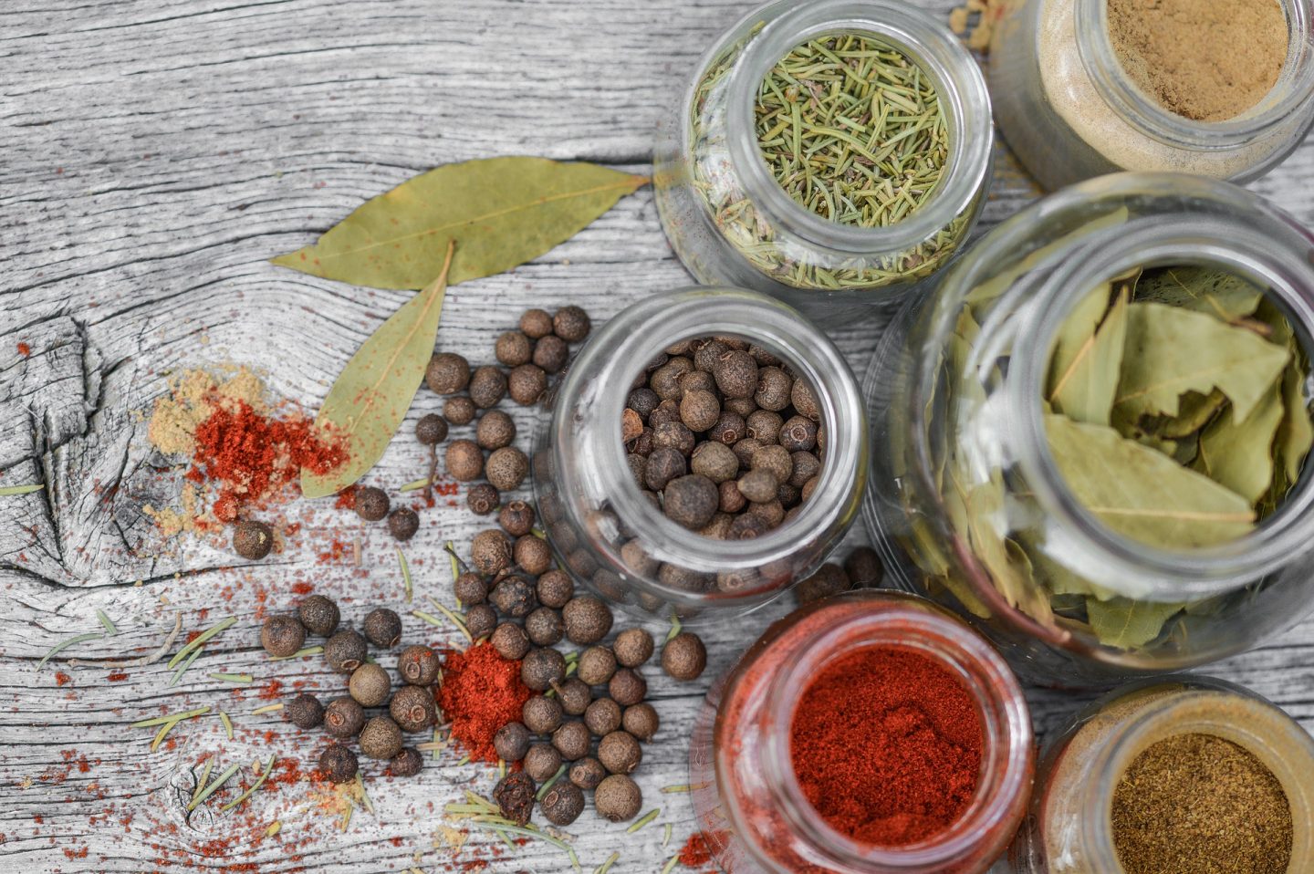 An assortment of herbs and spices - both are store cupboard kitchen essentials