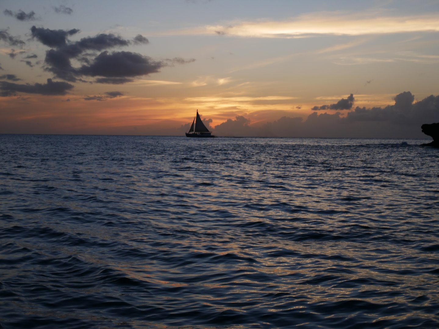 Sunset with a yacht in the distance