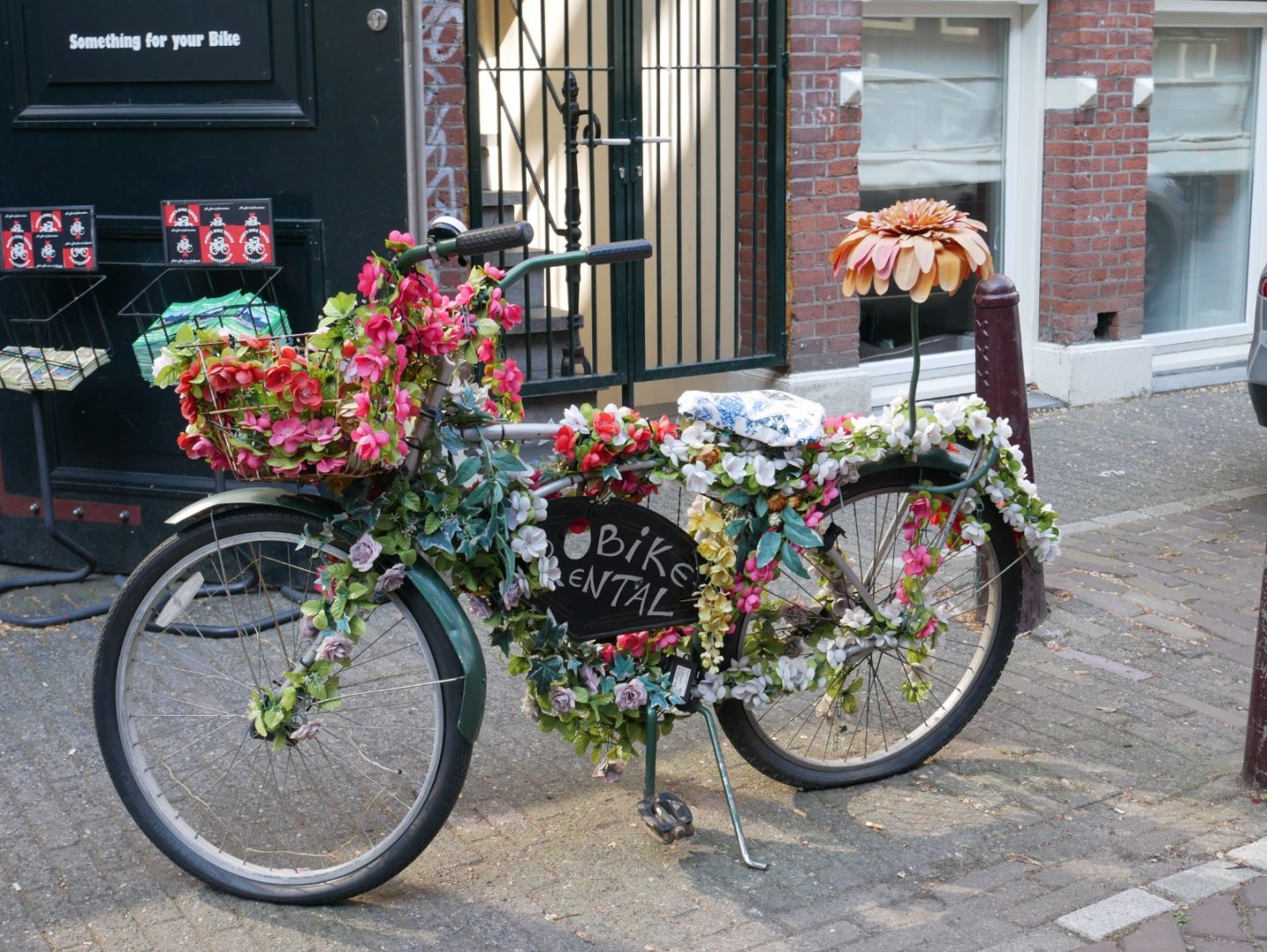 A bike covered in flowers in Amsterdam.