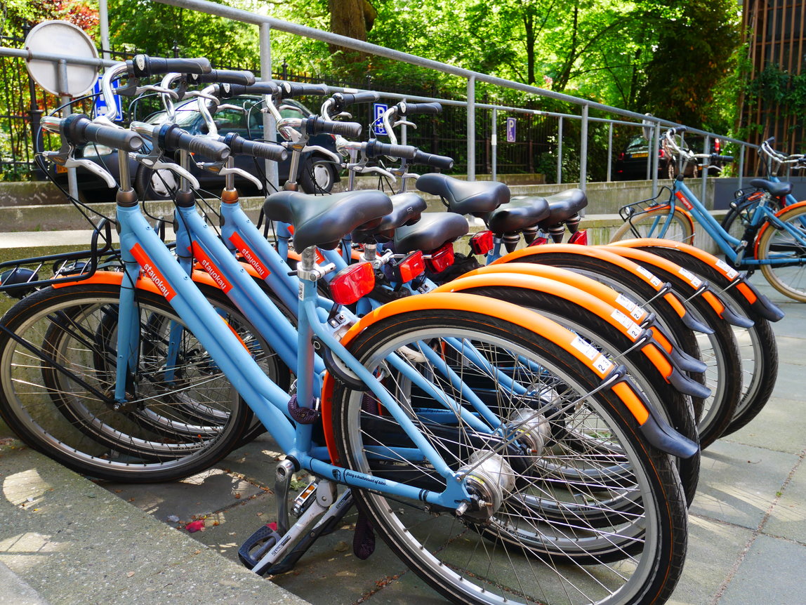 Bikes to rent lined up outside Stayokay Amsterdam Vondelpark hostel.