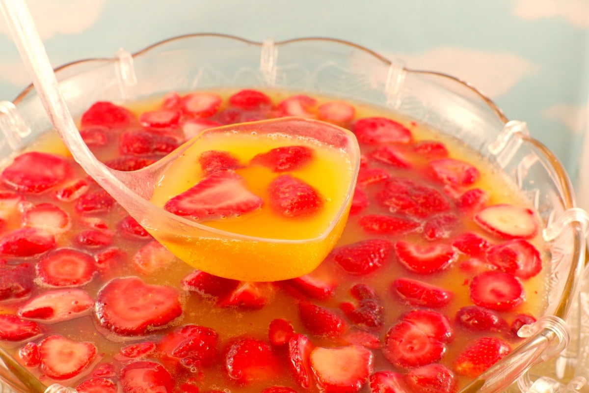 A large bowl of strawberry punch (non-alcoholic)
