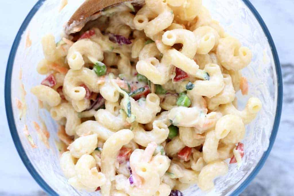 Macaroni salad in a creamy sauce with fresh veggies