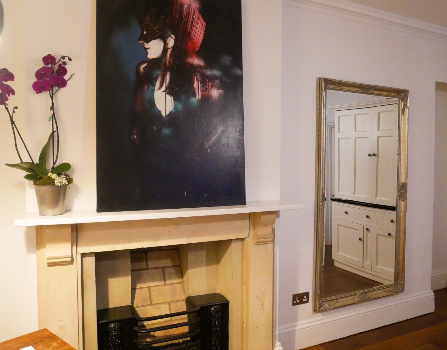 The fireplace in the living area at Berkeley Suites