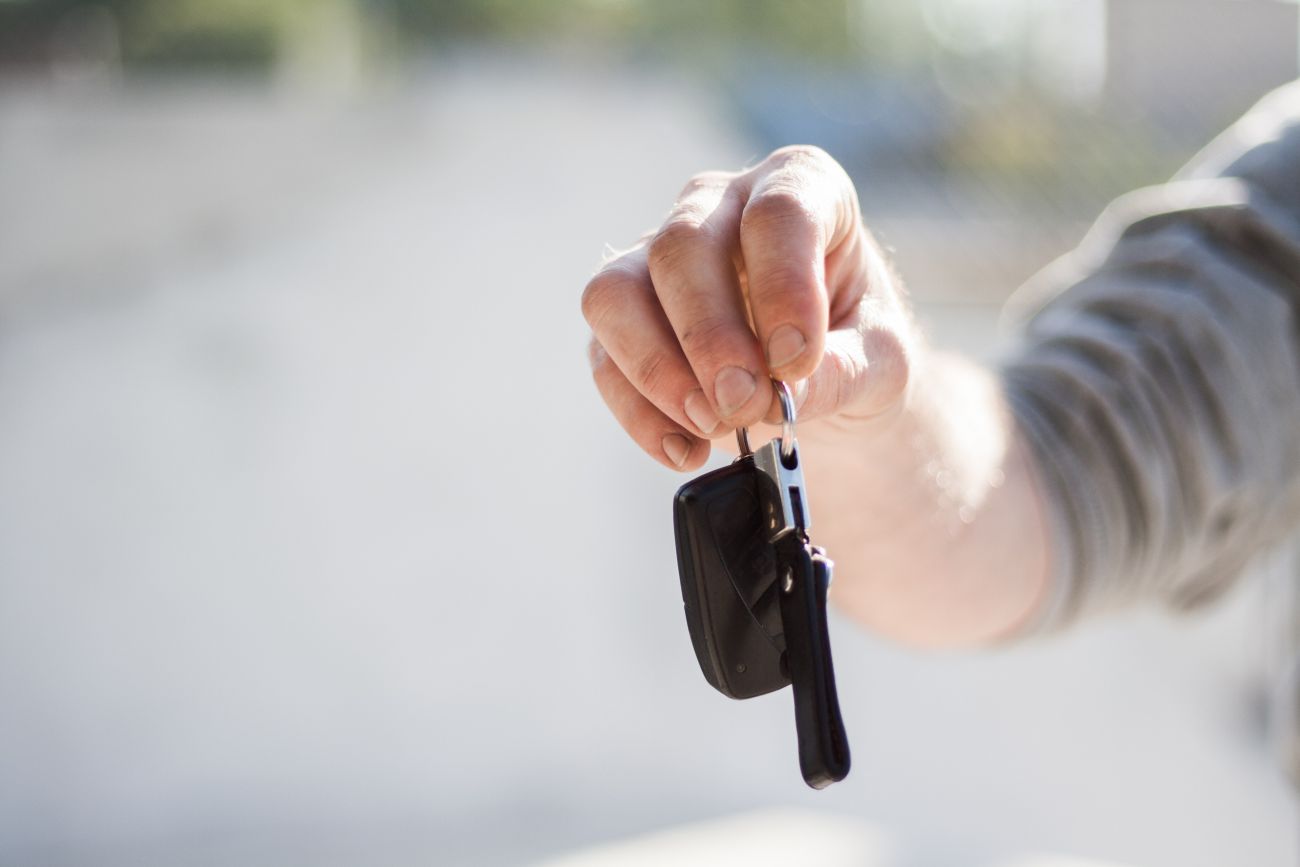 Someone's hand holding some car keys