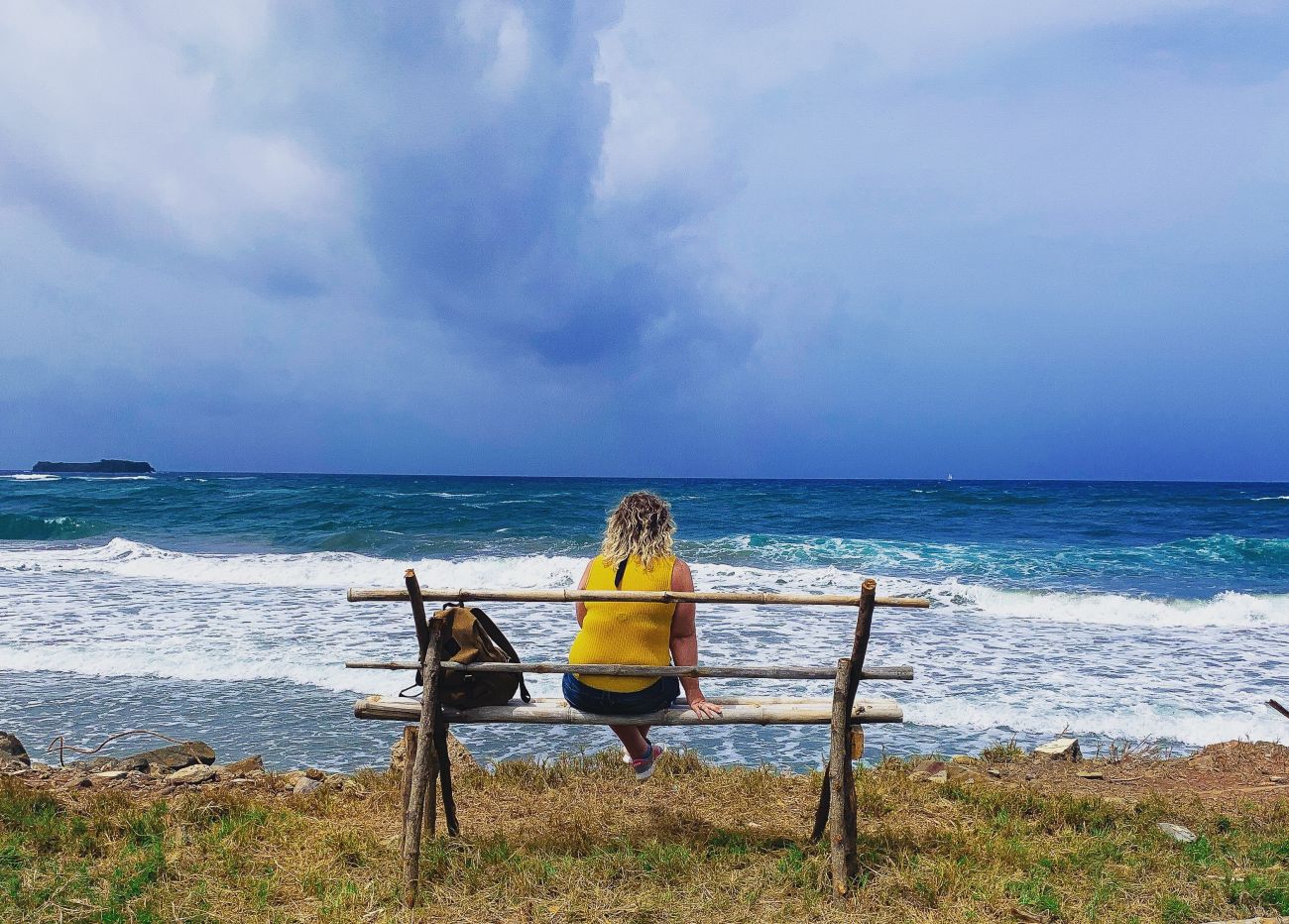 Lost in thought at Big Bay beach in St Andrew's, Grenada. Being able to get away by yourself is one of the key aspects of the importance of travelling for our mental health.