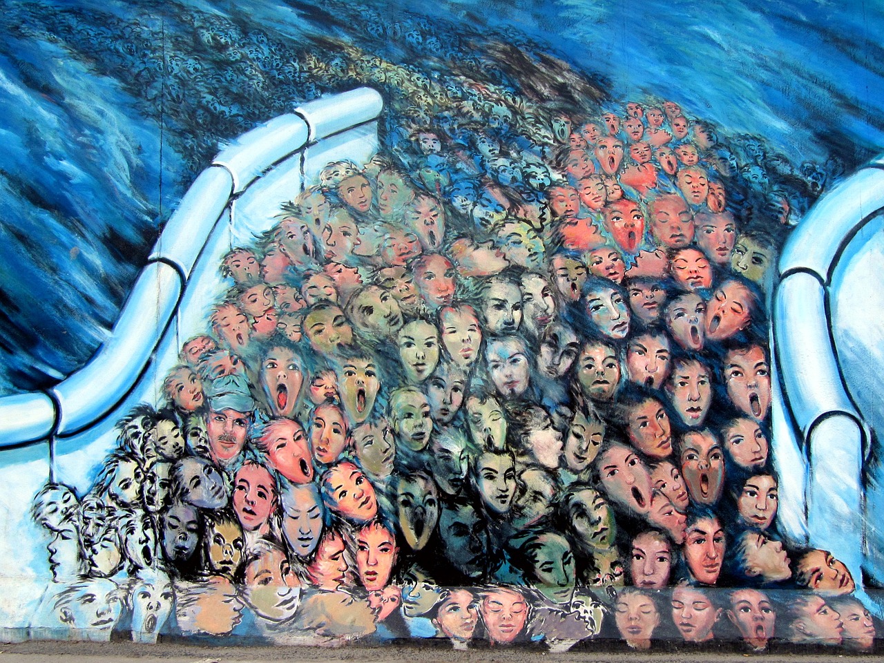 A section of the East Side Gallery of the Berlin Wall - one of the most iconic historical places in Europe.