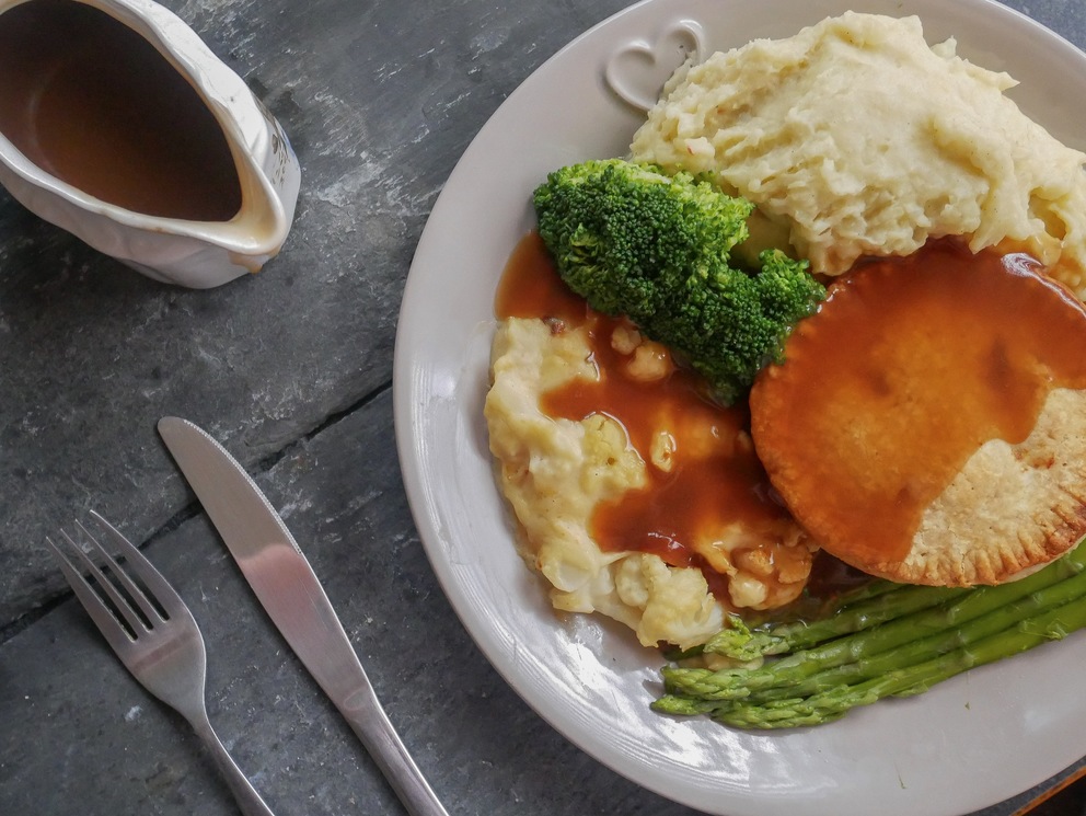 Pie and mash with gravy and greens - one of the most popular comfort foods for a cosy night-in this autumn.