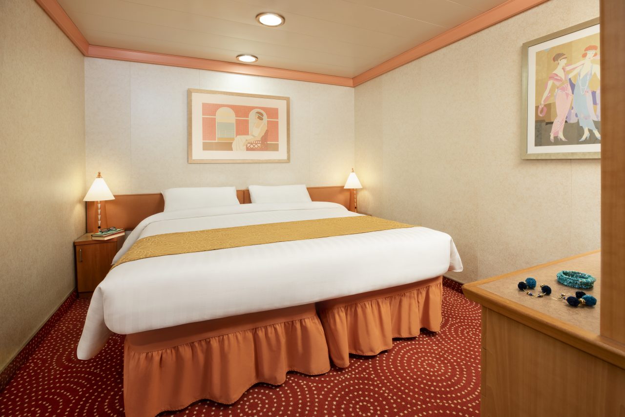 A king-side bedroom aboard a Costa Cruises ship.