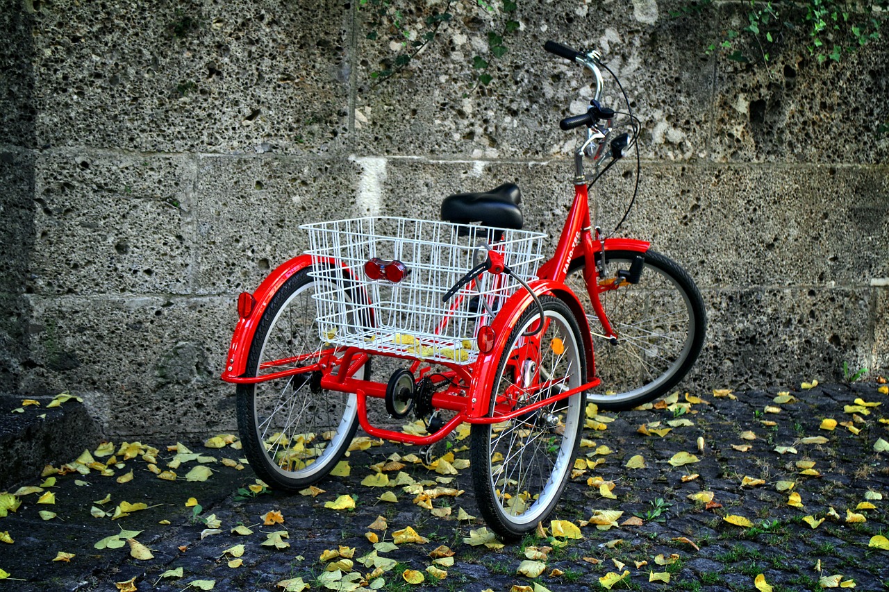Bright red tricycle for adults with a basket