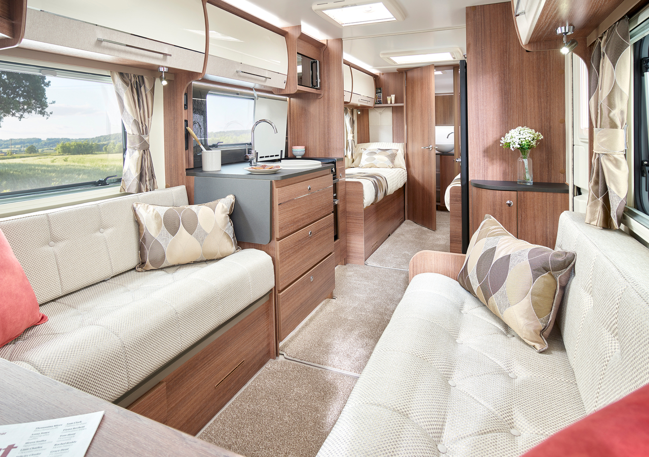 You'll be surprised at just how lavish modern caravans and motorhomes can be. Just take this Unicorn Black Edition with Cadiz interior, for example! Photo shows the lounge, bedroom and kitchen areas.
