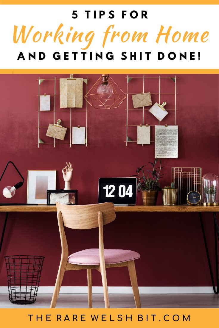 A home office with a maroon colour scheme