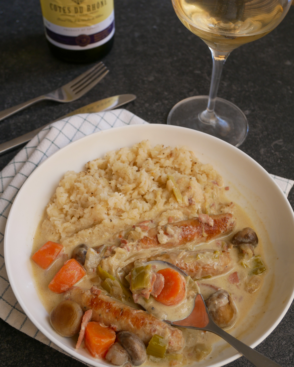 Creamy slow cooker chicken casserole made with chicken chipolatas and bacon