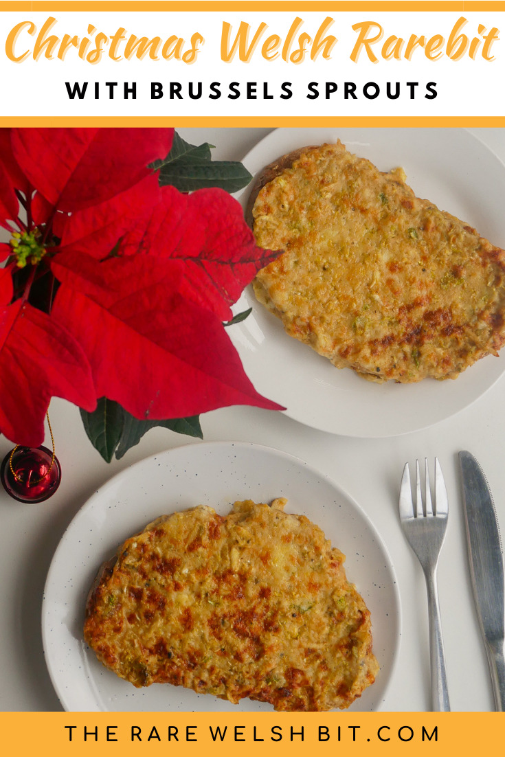 Traditional Welsh rarebit with Brussels sprouts, next to a Christmas poinsettia and a Christmas bauble