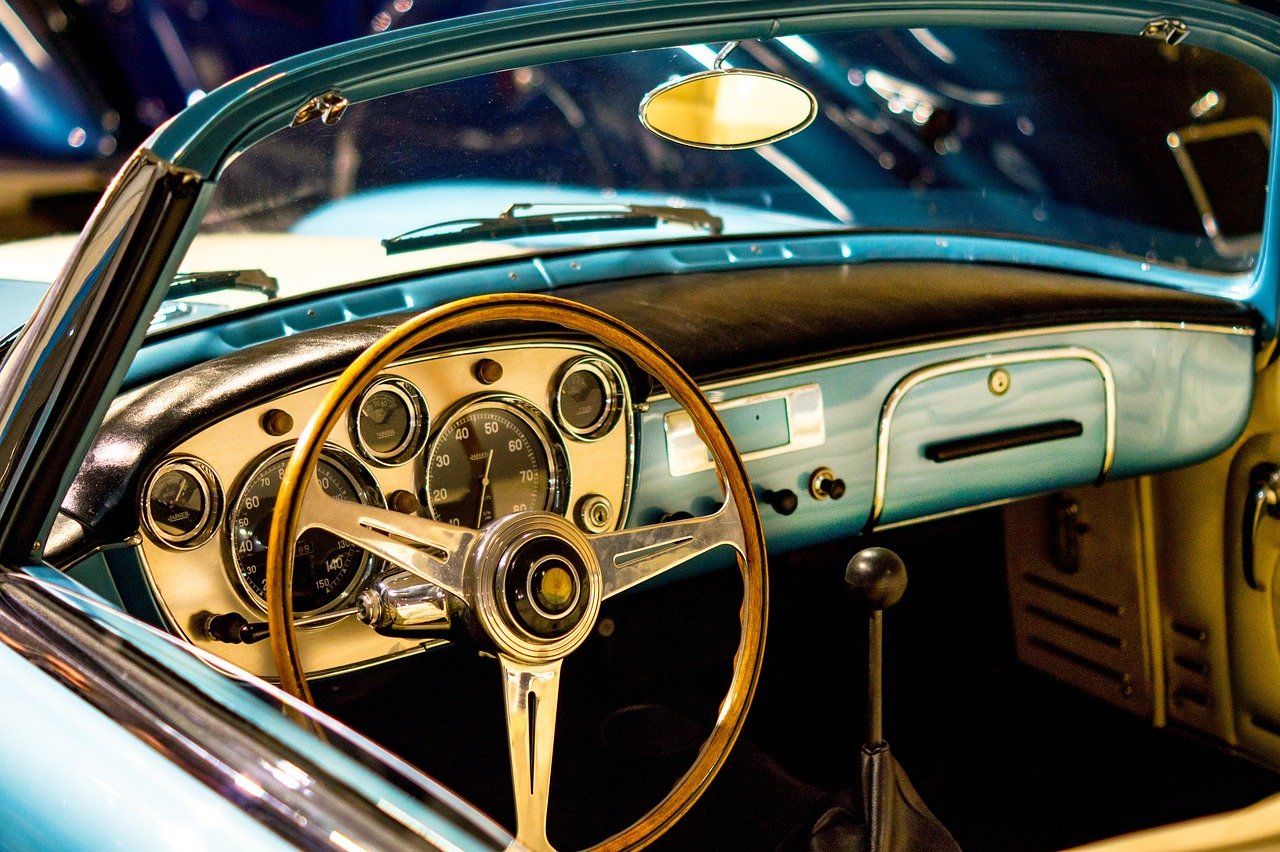 Old car dashboard and steering wheel