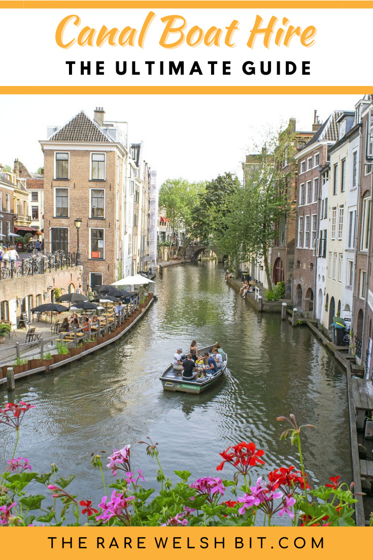 A boat sailing down a canal