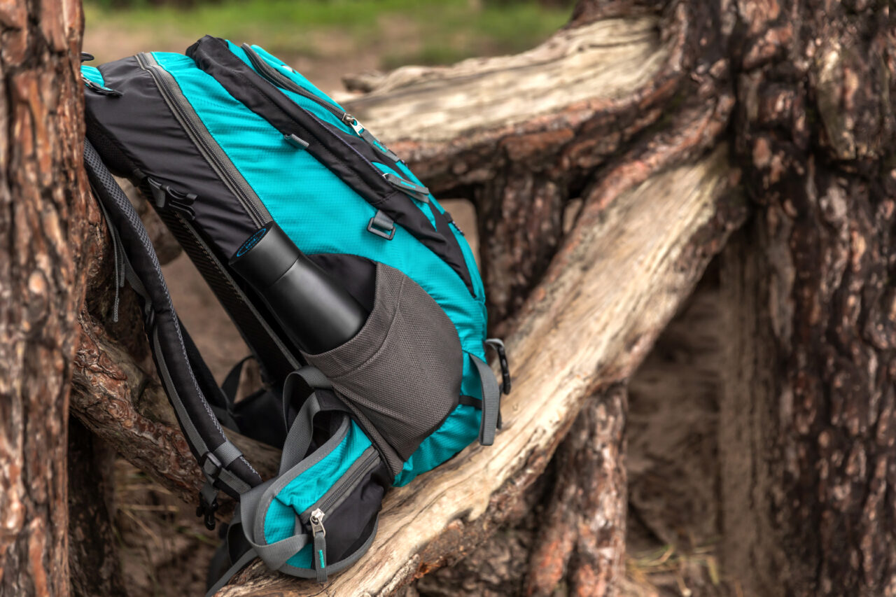 An Auron water bottle in a rucksack