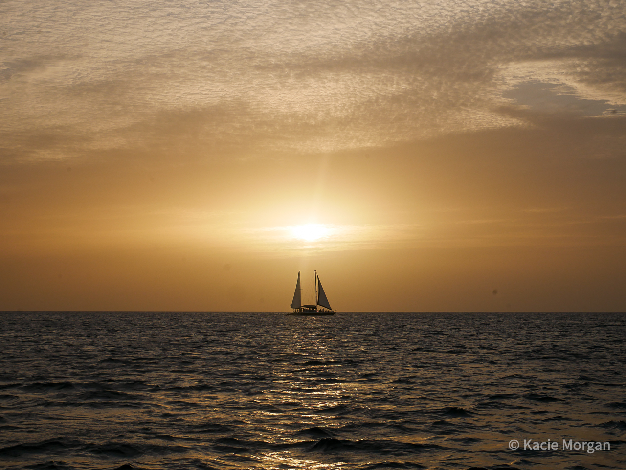 A sail boat sailing across the Caribbean Sea