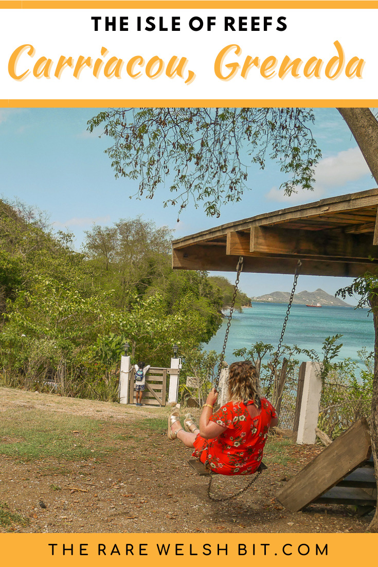 A girl in a swing, with views of the Caribbean Sea
