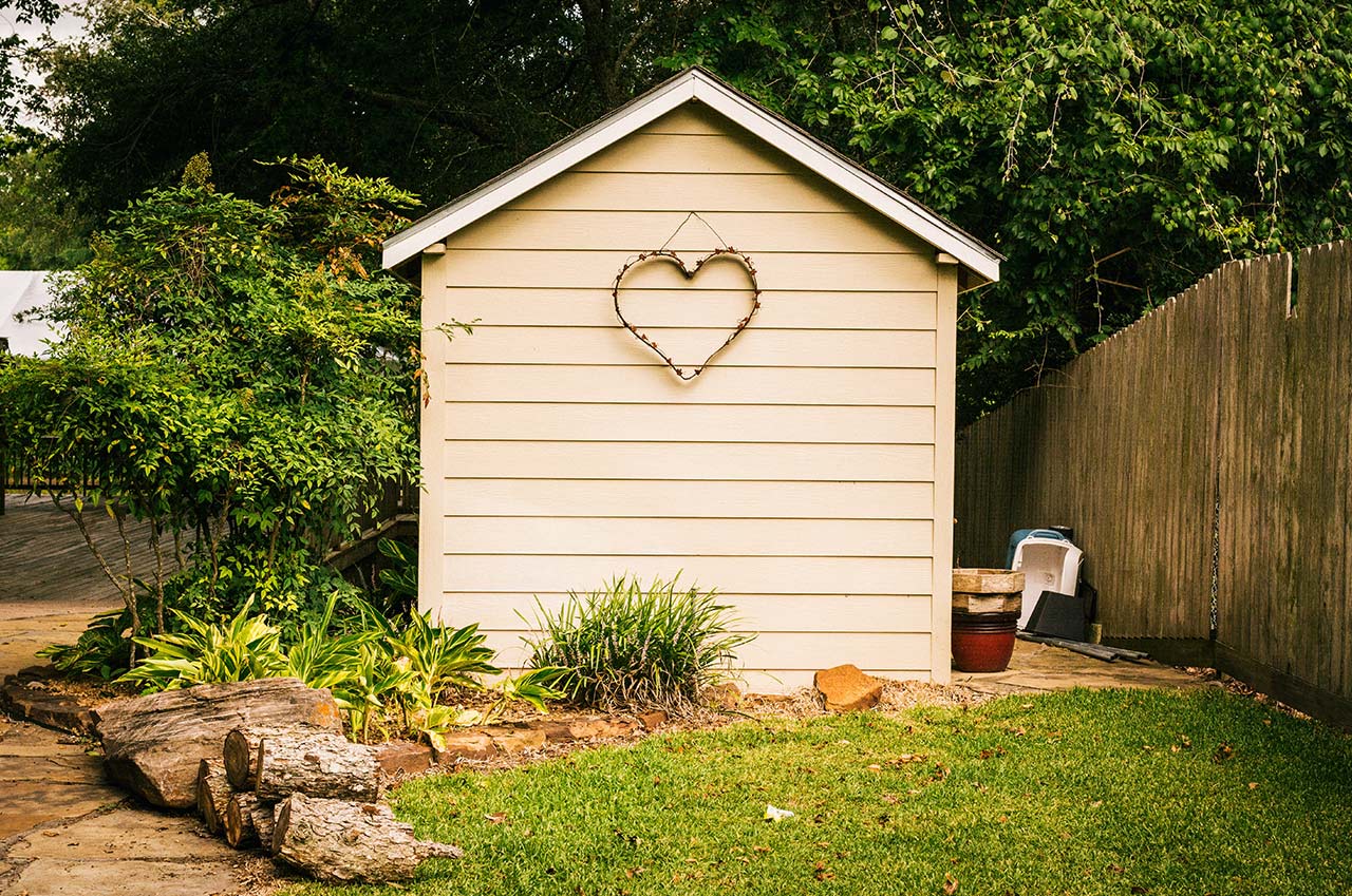 Heart-shaped wall art on the side of a shed.