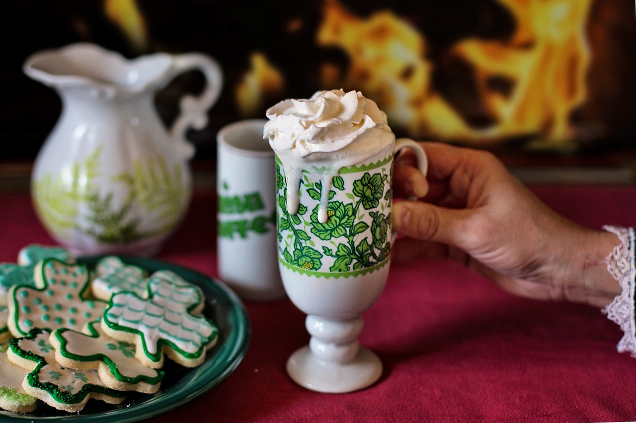 Frothy Irish coffee, next to Shamrock cookies