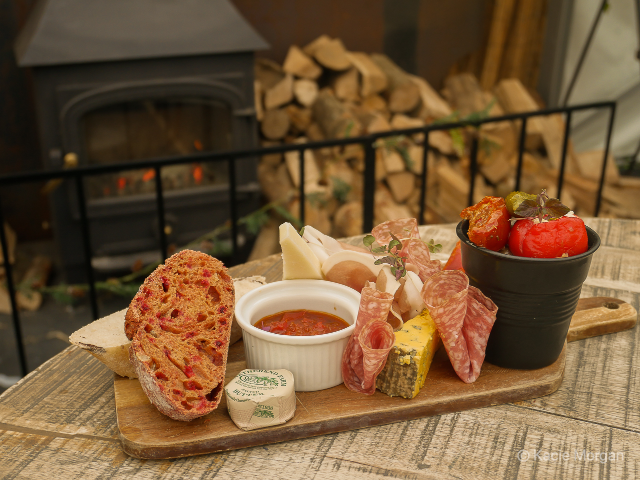 Deli cheeseboard on a plank