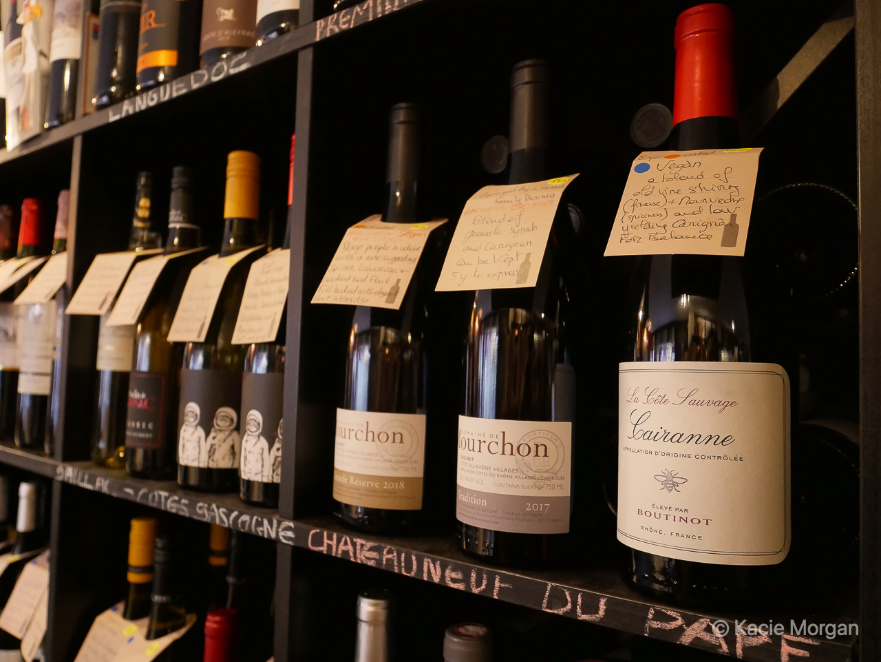 Different wines on display on the shelf at Tell Me Wine in Chepstow, Monmouthshire