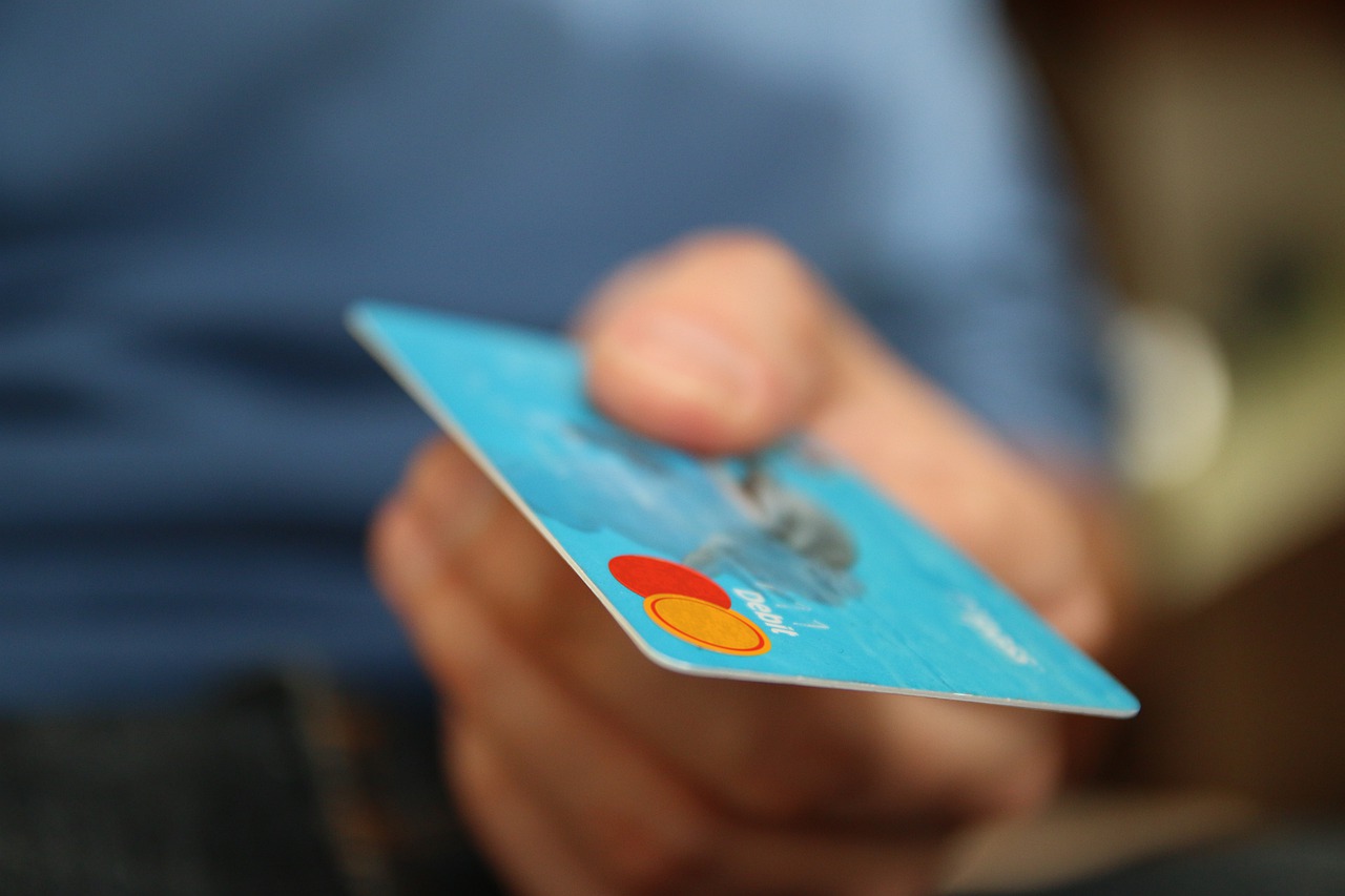 someone holding a credit card