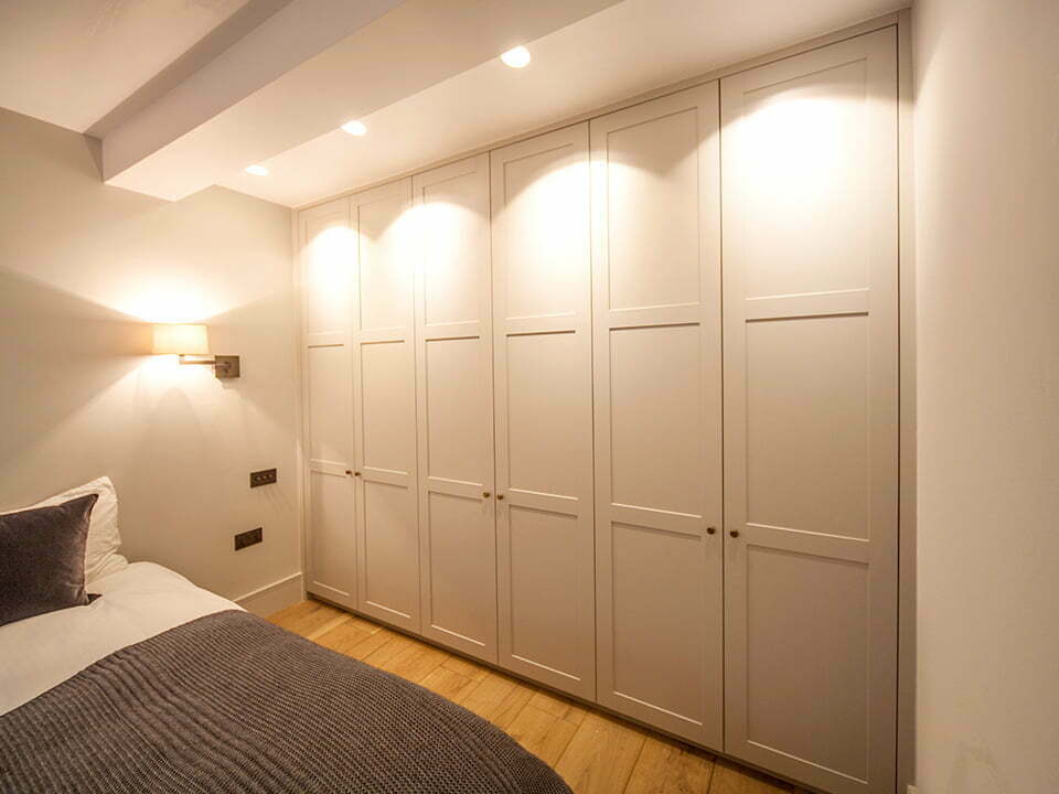 A built-in wardrobe in a bedroom
