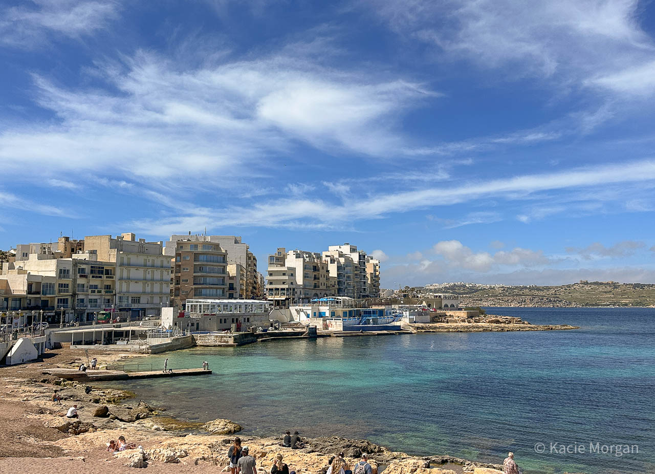 The beach and promenade in St Paul's Bay, a popular spot for a package holiday in Malta