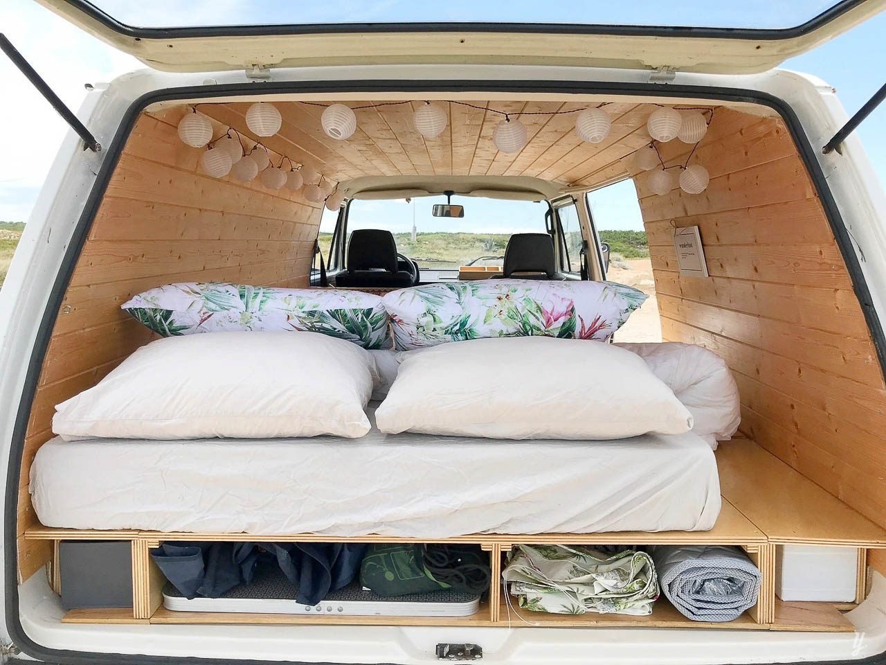 A bed inside a campervan