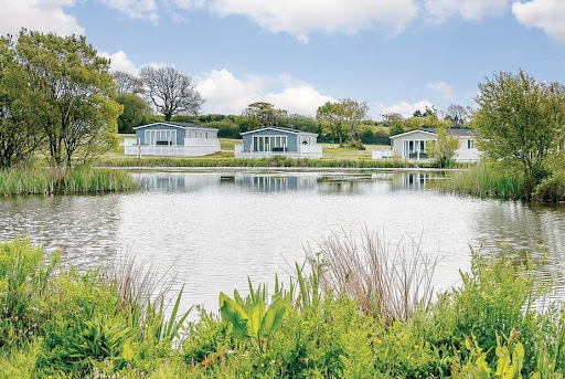 Fishguard Bay Resort - a lake surrounded by lodges/cabins