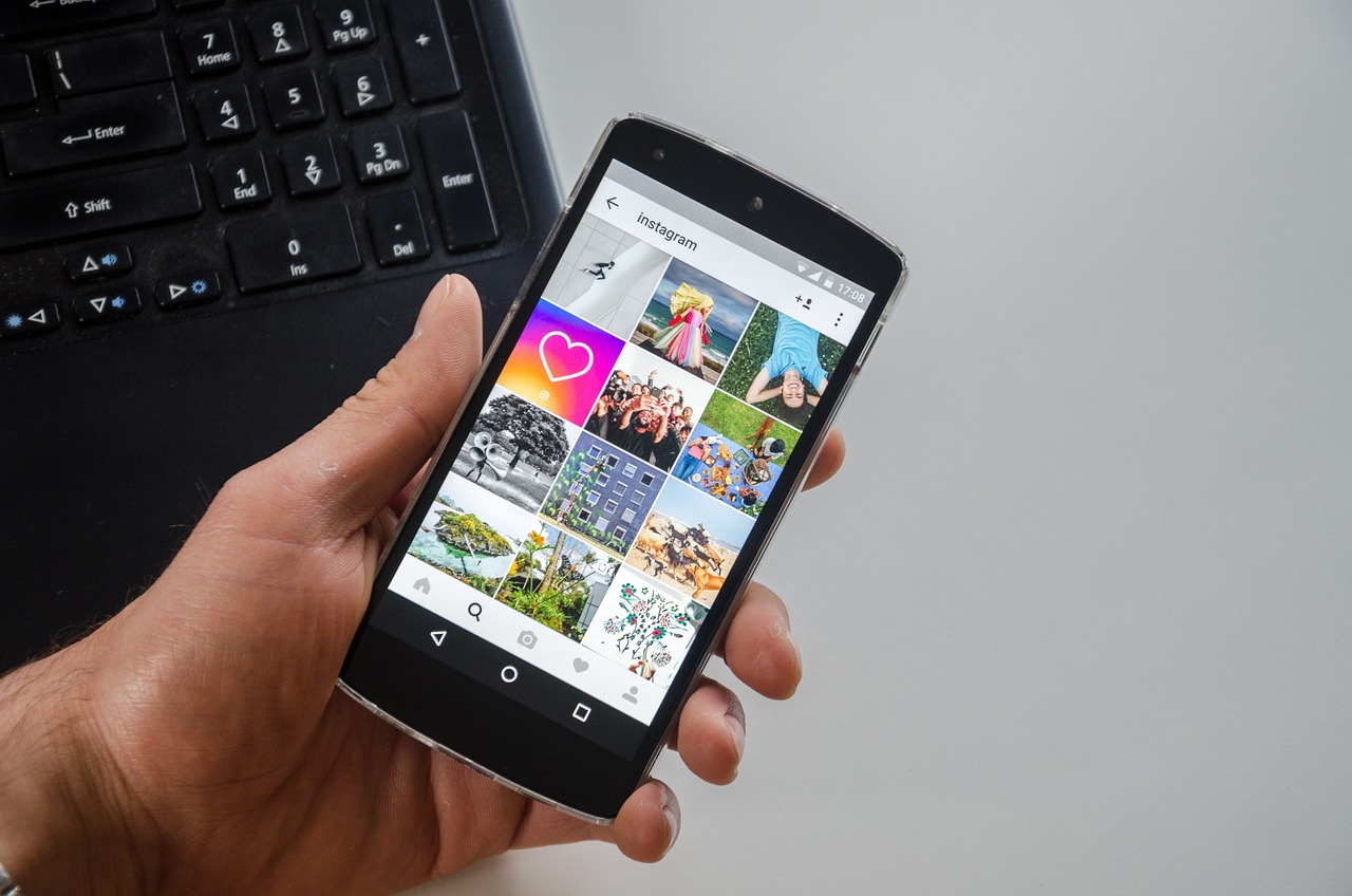 Instagram grid open on a smartphone in someone's hand