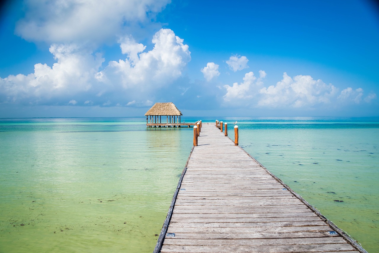 A wooden walkway over the sea leading to a villa on the island of Holbox in the Yucatan Peninsula, Mexico.