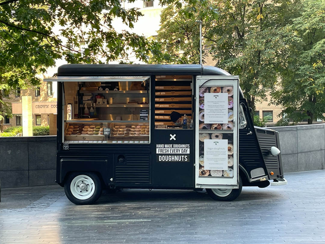 A food truck selling doughnuts.