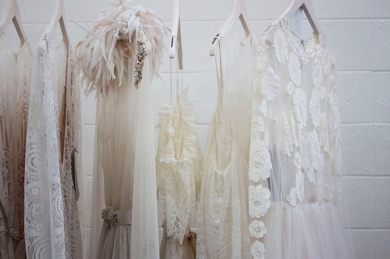 White and beige dresses hanging up