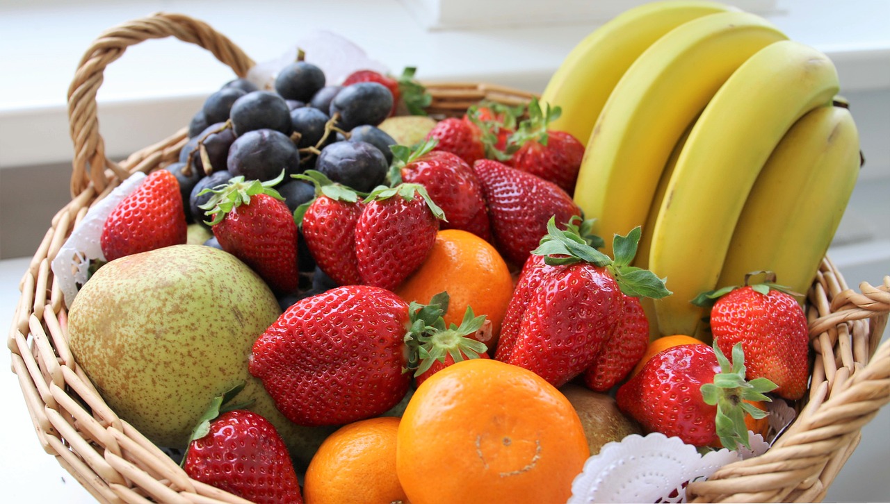 A wicker basket fillet with assorted fresh fruit.